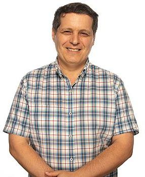 Headshot photo of Eduard Krivoruk standing in front of a white background.